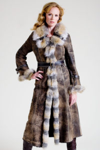 Saddle brown shearling coat with golden island fox trim
